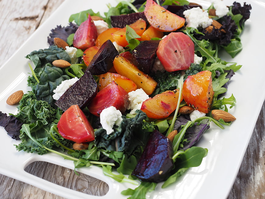 Fresh roasted beet and kale salad with goat cheese and almonds
