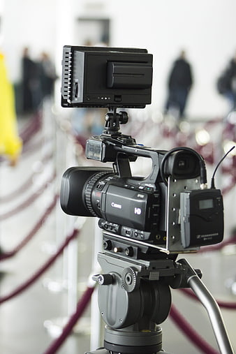 Professional Canon HD Video Camera on Tripod at Event