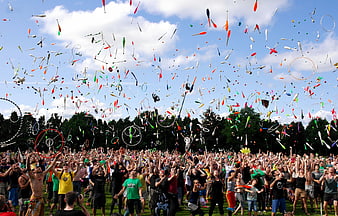 Crowd Throwing Colorful Objects into the Sky