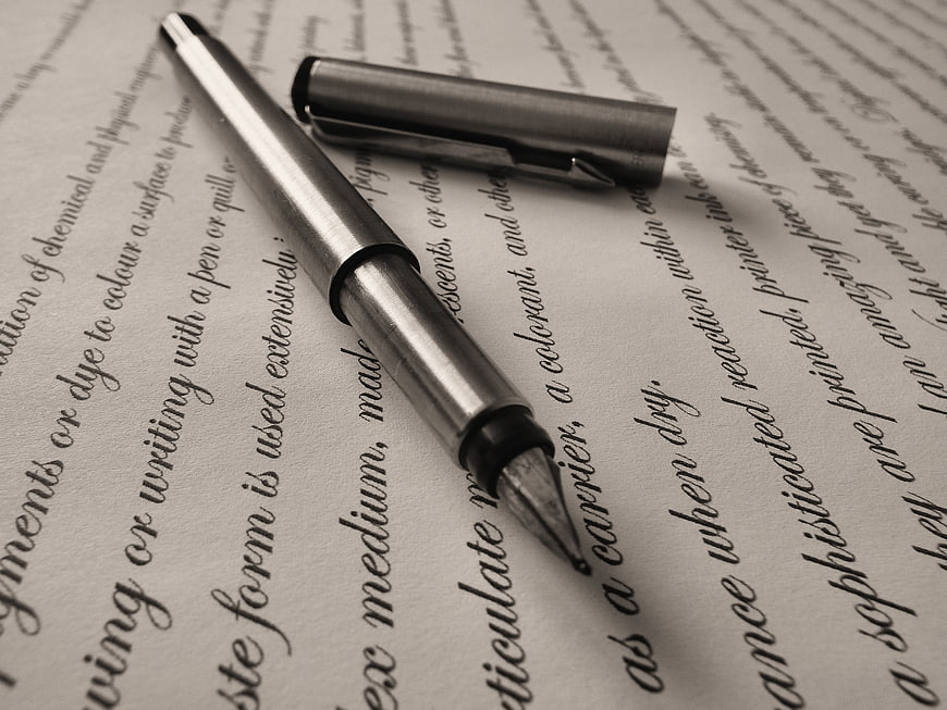 Silver fountain pen on vintage text paper