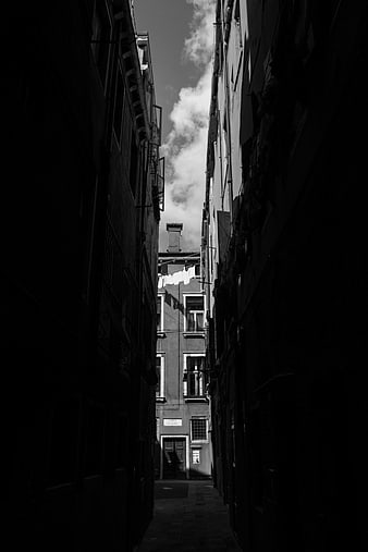 Dramatic black and white narrow alley in Venice, Italy