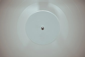Minimalist white ceiling light fixture with central bulb
