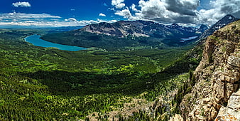 Panoramic Mountain Landscape with Turquoise Lake and Forest