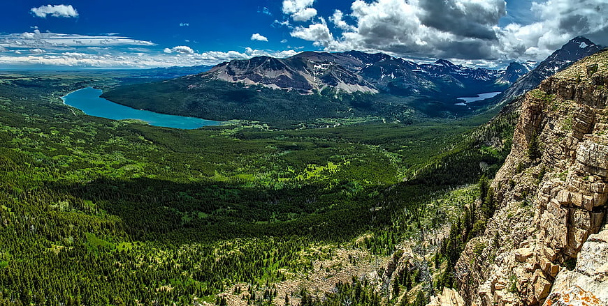 Panoramic Mountain Landscape with Turquoise Lake and Forest