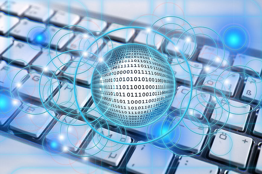 Digital Binary Sphere Floating Above Computer Keyboard