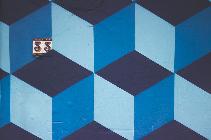 Blue geometric cube mural with number 33 tiles
