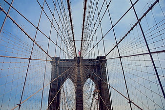 Low angle view of Brooklyn Bridge cables and tower