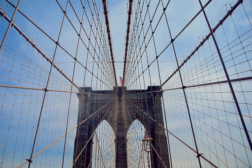 Low angle view of Brooklyn Bridge cables and tower