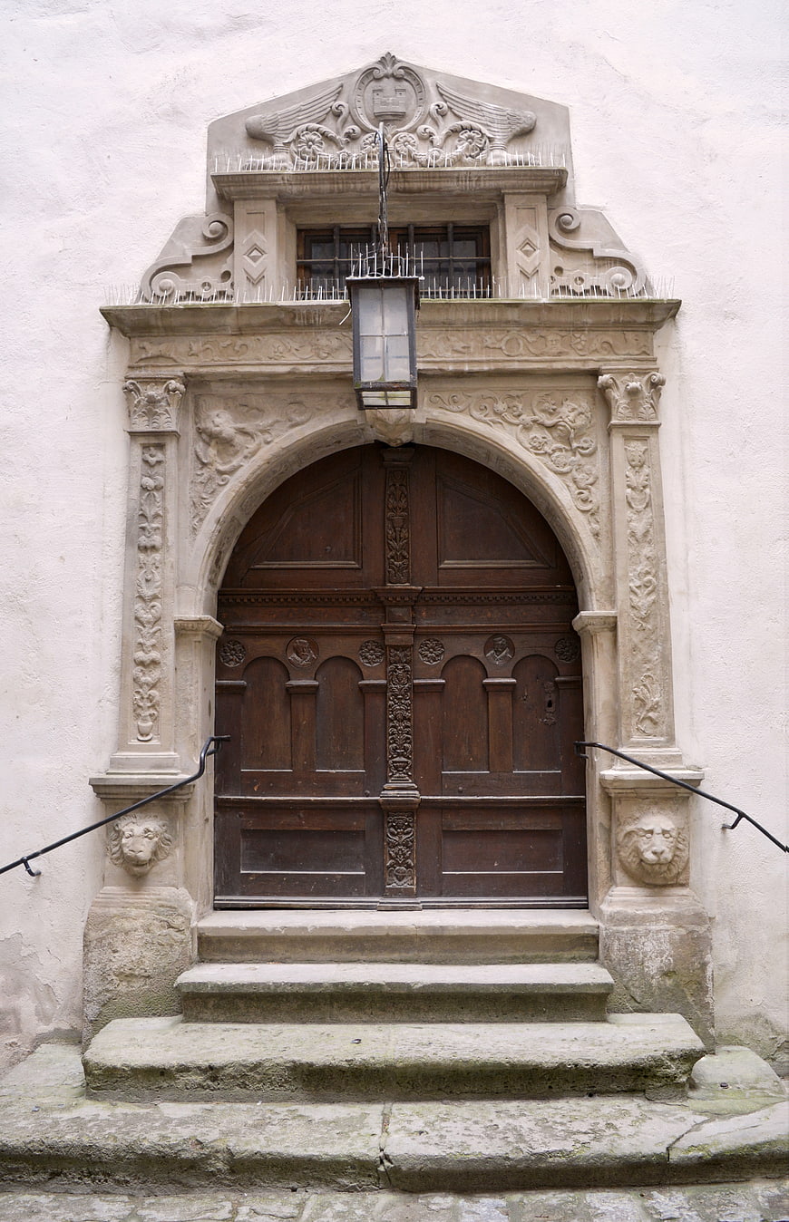 Ornate Historic Stone Archway with Wooden Door