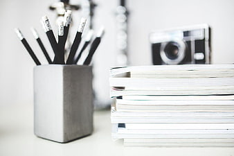 Minimalist Desk Setup with Pencils and Magazines