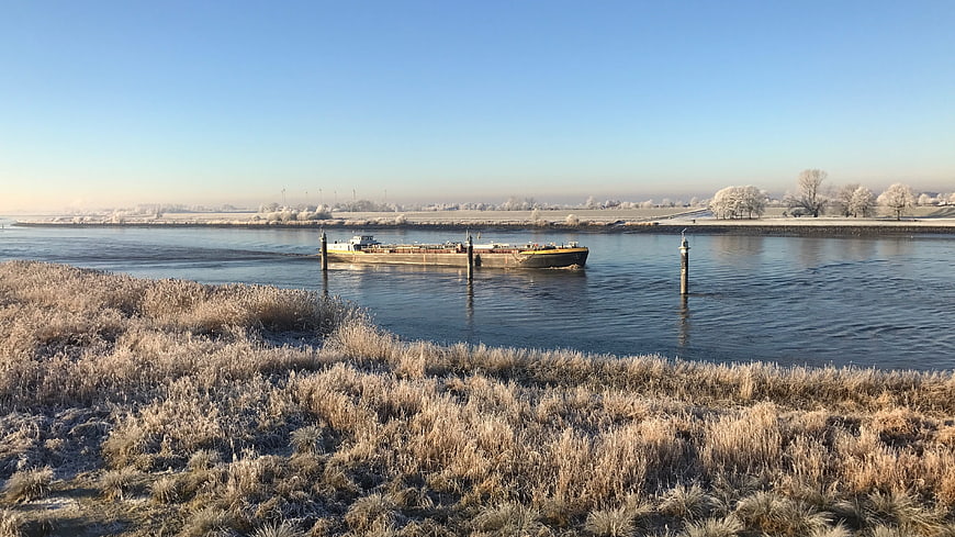 Cargo Barge on Frosty Winter River Landscape