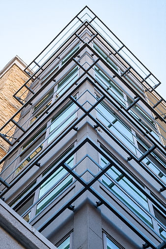 Low angle view of modern building with geometric metal framework
