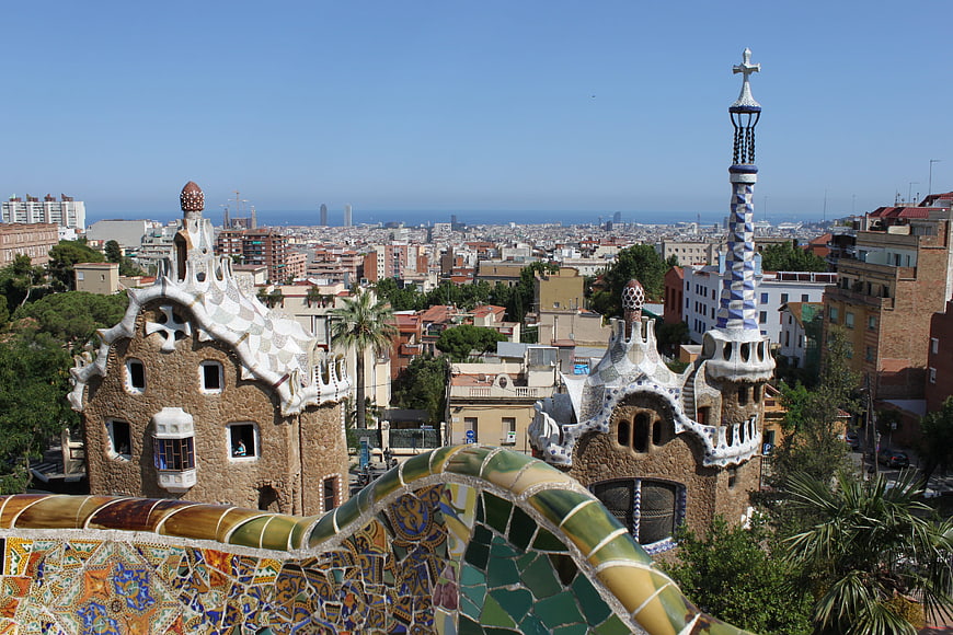 Colorful mosaic architecture at Park Güell overlooking Barcelona cityscape