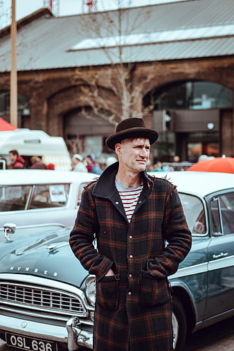 Man in Vintage Plaid Coat and Fedora by Classic Car