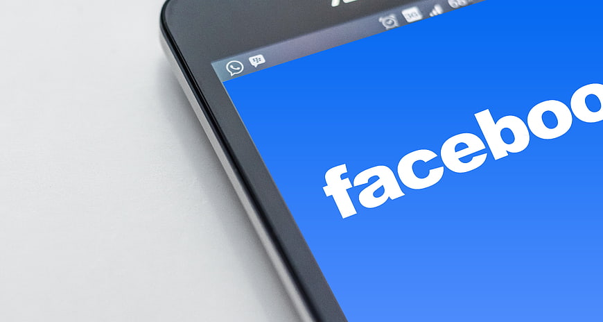 Close-up of Facebook logo on smartphone screen