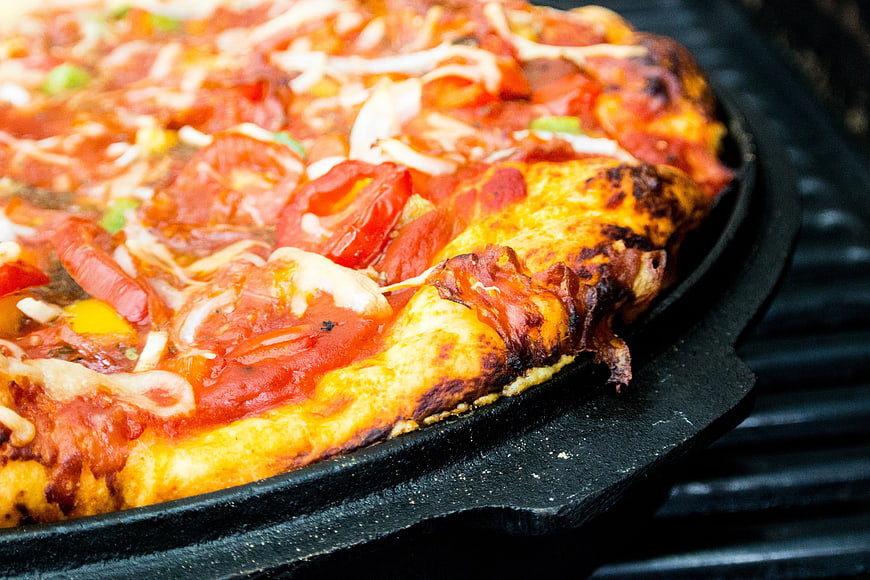 Grilled Pan Pizza With Tomato And Cheese On Cast Iron