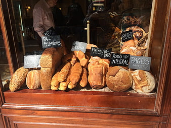 Artisan Bread Display In Bakery Window With Handwritten Signs