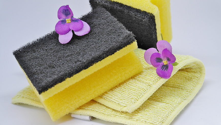 Yellow Cleaning Sponges with Purple Flowers on White Background