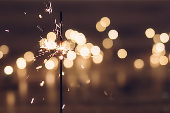Sparkler with Bokeh Lights at Night