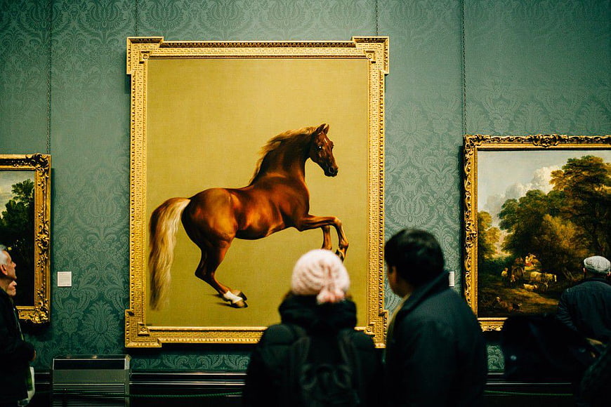 Visitors Viewing Horse Painting in Art Gallery