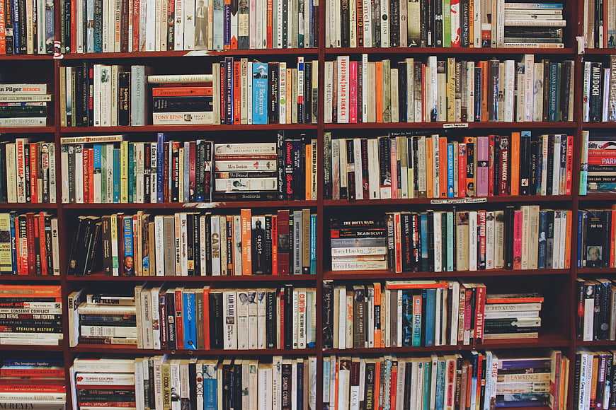 Full Bookshelves With Colorful Hardcover Books