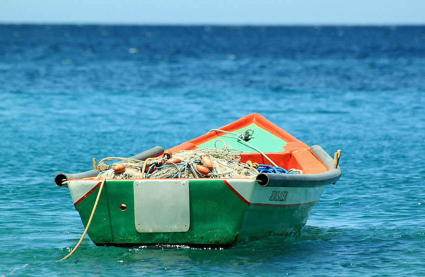 Colorful Fishing Boat Floating on Blue Sea