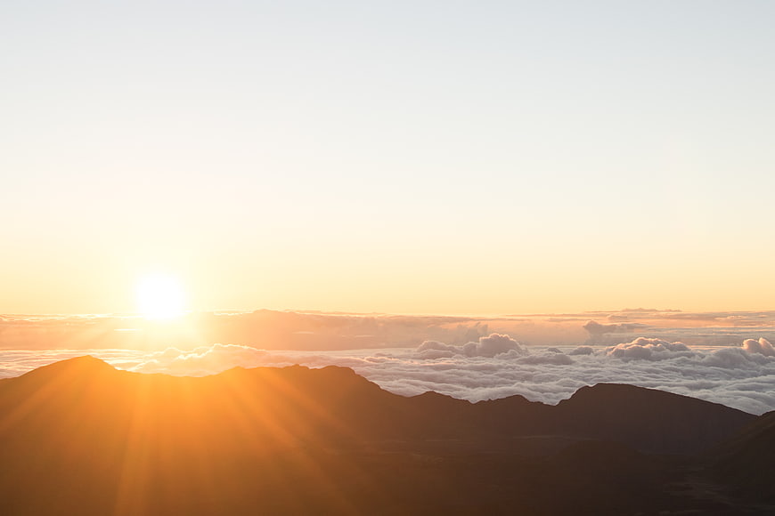 Sunrise Over Mountain Peaks and Sea of Clouds