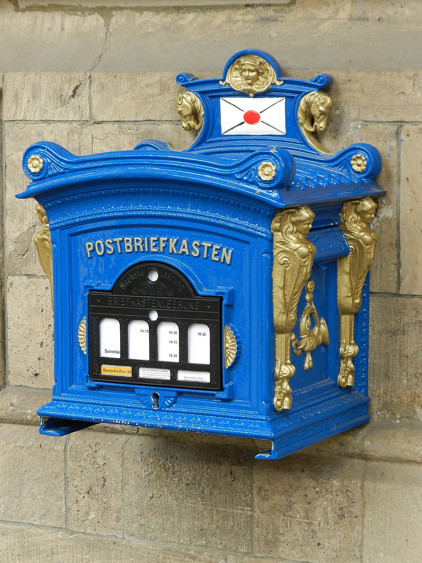 Vintage Blue and Gold German Post Box on Stone Wall