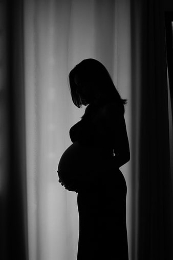 Silhouette of Pregnant Woman Holding Belly