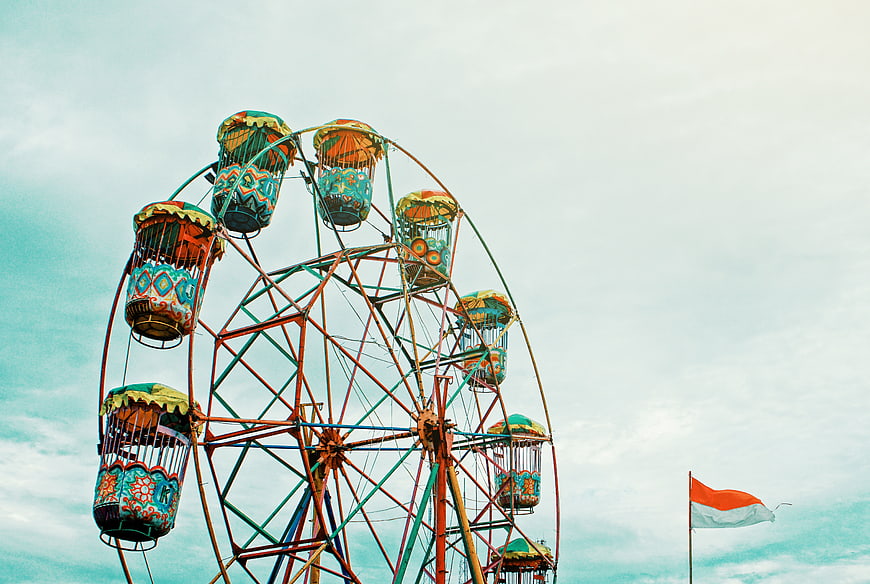 Colorful Vintage Ferris Wheel Against Blue Sky