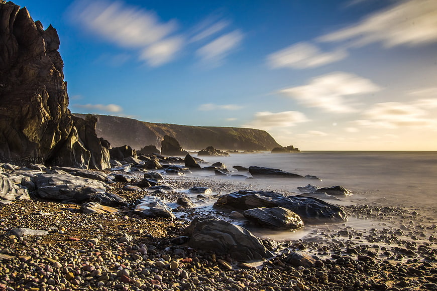 Dramatic Long Exposure Rocky Coastline at Sunset