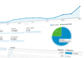Blurred Analytics Dashboard with Blue and Green Charts