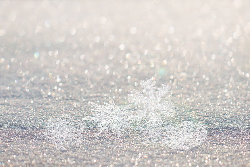 Silver Snowflakes on Glittering Background with Bokeh