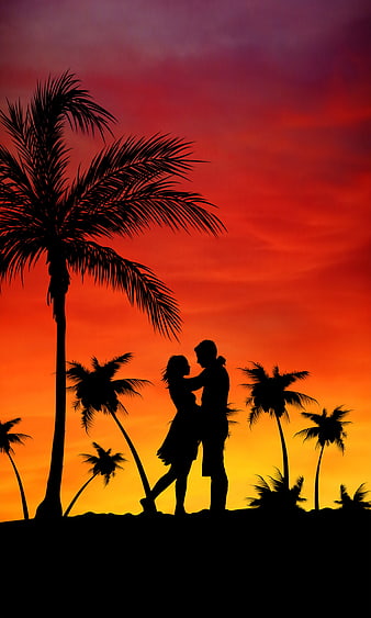 Romantic Couple Silhouette Dancing Under Palm Trees At Sunset