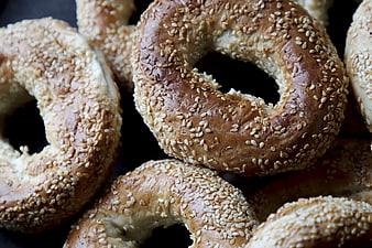 Close-up of Fresh Sesame Bagels on Dark Background