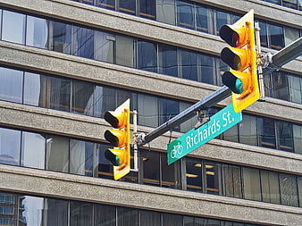 Yellow traffic lights and Richards St sign in urban setting