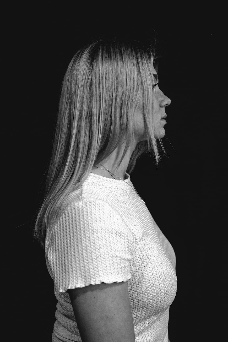 Black and white profile portrait of a woman with long hair