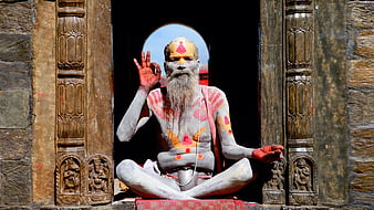 Hindu Sadhu Meditating in Temple Doorway with Body Paint