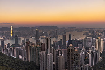 Hong Kong Cityscape at Sunset with Victoria Harbour and Skyscrapers