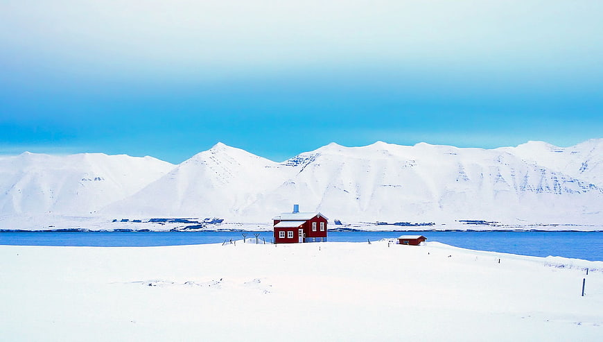 Red House in Snowy Arctic Landscape