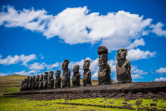 Moai Statues on Easter Island Under Blue Sky