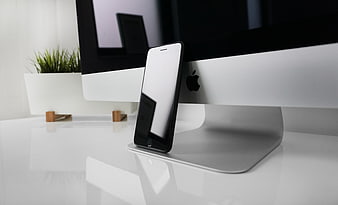 Modern Office Workspace with Smartphone and Desktop Computer