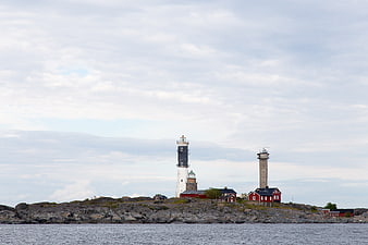 Two Lighthouses on Rocky Island Coastline