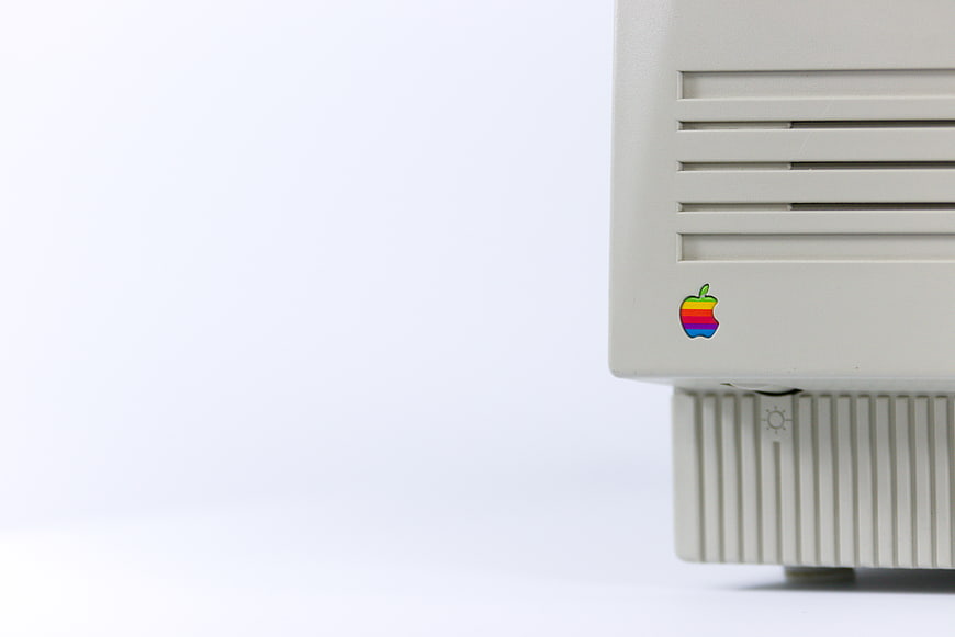 Vintage Apple Computer Corner with Rainbow Logo on White Background