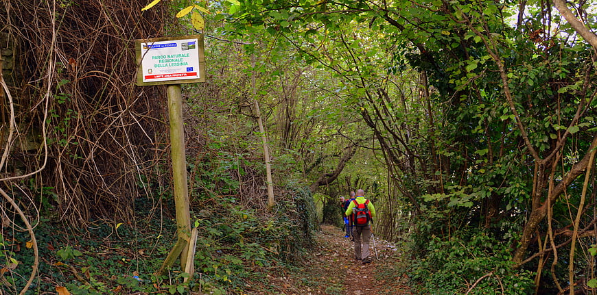 Hikers walking on trail in Lessinia Regional Natural Park Italy