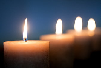 Close-up of lit candles with shallow depth of field