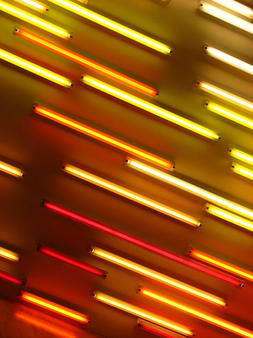 Abstract Diagonal Neon Light Tubes in Red, Orange, and Yellow