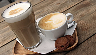 Latte Macchiato and Cappuccino with Cookies on Wooden Tray