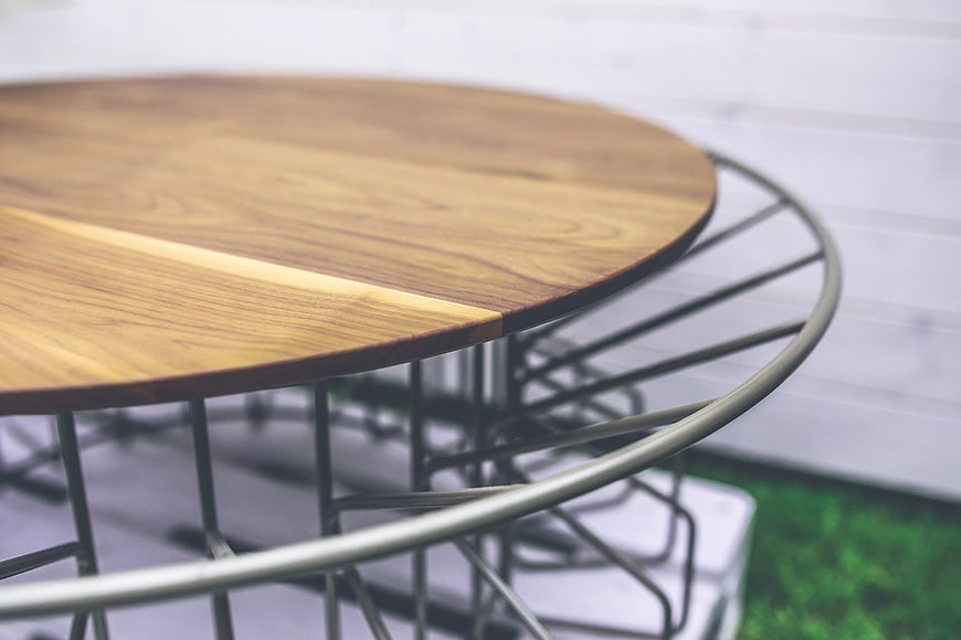 Modern round wooden table with metal wire base