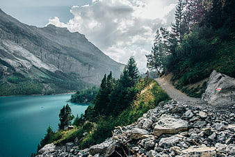 Hiking Trail Along Turquoise Alpine Lake with Mountains